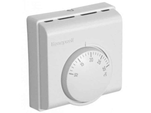 Honeywell T4360B‑1015‑16A room thermostat in beige plastic housing with toggle switch marked ‘On’/’Off’, central temperature dial, and two‑pole wiring block visible at the base.